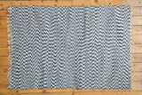 Geometric navy and white organic cotton rag rug with a hand-woven zigzag texture.