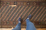 Storied wear on an antique Shirvan runner showing cotton wefts beneath the striped wool pile.