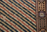 An antique Shirvan's unique design showing the striped field alongside its separate geometric border.