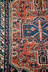Geometric navy and rust red patterns with luster on this vintage Hamadan rug.
