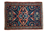 Vintage Kurdish rug mat with oblong medallion, floral motifs in deep blue, peach, red.