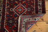 Hand-knotted foundation and tight fringe of the vintage Engelas rug with cherry red floral pattern.