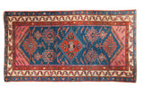 Antique Malayer rug runner, indigo field with geometric tribal motifs, human figures, birds, circa 1915.