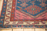 Antique Malayer rug corner, indigo blue, red, and beige tribal borders, worn fringe.