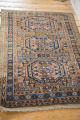 Hand knotted vintage Belouch rug fringe and tribal border with blue, rose arrow motifs.