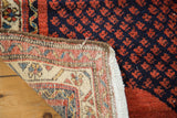 Hand knotted cotton foundation detail of Vintage Persian rug with repeating boteh field.