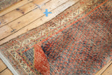Corner view of Vintage Northwest Persian rug, ivory fringe and rust boteh field.