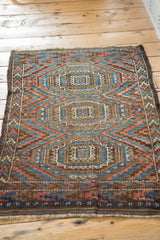 Hand-knotted antique Beshir rug with goat hair selvage and geometric gul pattern.