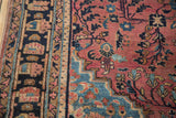 Distressed dusty raspberry field with teal spandrel and navy palmette border detail.