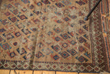 The storied late 19th century Belouch rug's pinwheel pattern and detailed tribal border.