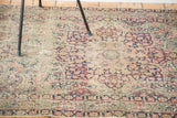 Ornate milfleur field details of hand-knotted Antique Kerman rug in soft rose and navy.