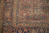 Low pile antique Tabriz rug corner, featuring herati motif in softened rust and navy.