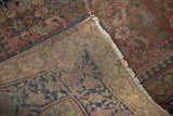 Antique Tabriz rug reverse shows cotton foundation, mended side, and distressed Herati motif.