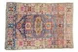 Vintage Lilihan rug, blue field, oblong green medallion, unique blush-saffron samovar motifs.