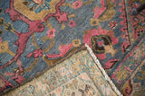 Vintage Lilihan rug corner folded, revealing full pile, re-selvaged edge, and hand-knotted reverse.