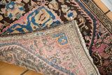 Close-up of the hand-knotted back and wool pile on an antique Farahan Sarouk rug.