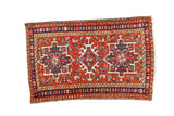 Vintage Persian Karaja rug mat with geometric triple star medallions on a brick red field, 1'11