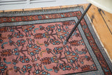 Persian Malayer rug's madder root red floral bouquet and sky blue arrow border.