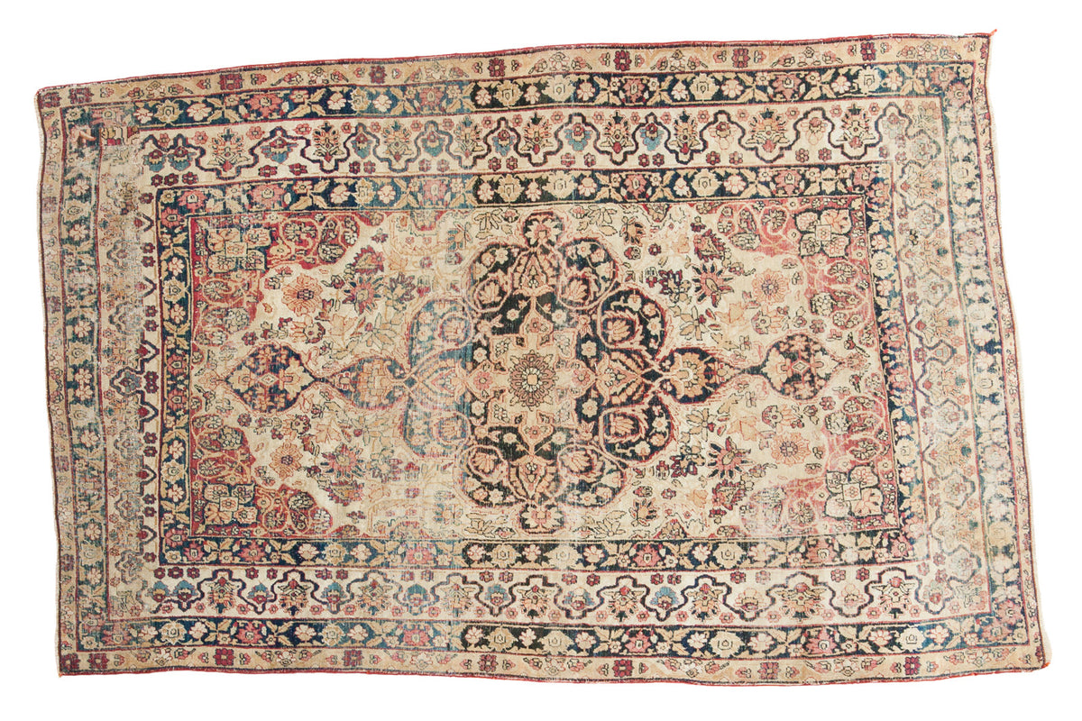 Antique Lavar Kerman rug with oversized medallion, unique floral border, beige, navy, cochineal red, 4'2" x 6'5".
