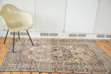 Antique Kerman rug with large dark medallion, cochineal red, Laleh Abassi-like dragon border.