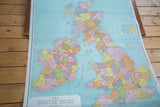 Vintage British Isles map displaying counties in vibrant pastel shades.
