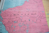 Vibrant pink landmass and black geographic text on the antique Australia map.