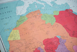 Vibrant orange, green, and pink colors of Great Sahara, Kanem, Bornu on vintage Africa map.