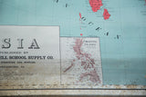 Antique Asia map detail showing Philippine Islands, McConnell text, teal sea, aged lower edge.