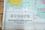 Antique McConnell map detail: 'EUROPE' title, publisher, and lower edge patina.
