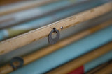 Close-up of a vintage map dowel with a metal pull ring embossed with 
