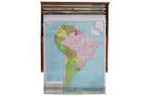 Vintage pull-down map South America, vibrant colored countries, blue ocean, bottom wear.