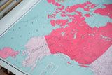 Northern landmasses in vibrant pink and light blue ocean on the antique North America map.