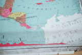 Close-up of vintage North America map, showing red elevation profile and bottom discoloration.