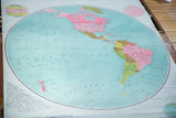 Antique Western Hemisphere map detail: vibrant teal Pacific, pink North America, fine typography.