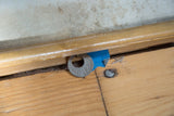 Close-up of vintage pull down map's wooden dowel and 