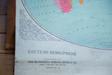 Bottom detail of the vintage Eastern Hemisphere map, showing title, publisher, and aged patina.