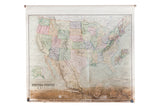 Antique pull-down map of USA and Mexico with subdued pastel colors and strong bottom edge discoloration.