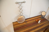 Extended view of antique barber mirror, fleur de lis hardware and silver paint.