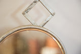 Distressed silver accordion arm detail connecting to the antique mirror frame.