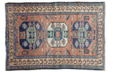 Vintage Persian Meshkin rug with triple octagonal medallions, blush pictorial field, and animal border.