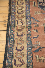 Beige border with rectilinear animals and geometric figures on the dusty blush field.
