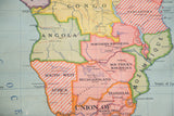 Close-up of pastel-toned Southern Africa on vintage Nystrom map, highlighting colonial borders.