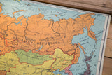 Vintage map detail of pale blue Sea of Okhotsk and orange Kamchatka peninsula.