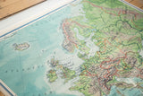 Nystrom pull-down map detail of Southern and Central Europe with subdued blues and greens.