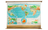 Vintage 1958 Denoyer Geppert Series pull down world map, vibrant continents, blue oceans.