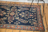 Antique Mohajeran Sarouk rug: dark blue field with blush rose palmette border.