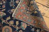 Antique Farahan Mohajeran Sarouk rug: blush rose border, dark blue field, palmettes, new selvage.