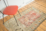 Distressed antique Caucasian prayer rug with red Mehrab, geometric tribal patterns, and Laleh Abbasi border.