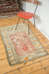 Antique Caucasian prayer rug corner, featuring geometric star and crab motifs, Laleh Abbasi border, and time-softened red, orange, and ivory tones.