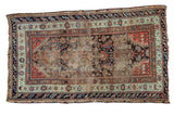 Antique Demirci rug featuring worn aesthetic, sickle herati motifs, and time-softened terracotta, blue, earthen tones.